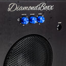 zoomed in view of diamondboxx logo and power button on the front of black SUB8.2 with blue knobs