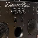 zoomed in view of diamondboxx logo, power, and tws buttons on the front of black M3 speaker with black knobs