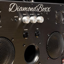 zoomed in view of diamondboxx logo, power, and tws buttons on the front of black M3 speaker with silver knobs